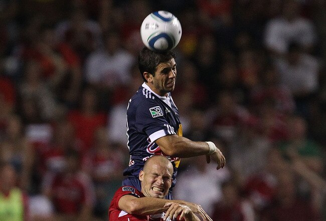 BRIDGEVIEW, IL - AUGUST 08: Carlos Mendes #44 of the New York Red Bulls heads the ball over Freddie Ljungberg #8 of the Chicago Fire in an MLS match on August 8, 2010 at Toyota Park in Bridgeview, Illinois. The Fire and the Red Bulls tied 0-0. (Photo by Jonathan Daniel/Getty Images)