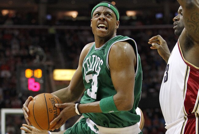 CLEVELAND - MAY 11:  Paul Pierce #34 of the Boston Celtics tries to get a shot off over Shaquille O'Neal #33 of the Cleveland Cavaliers in Game Five of the Eastern Conference Semifinals during the 2010 NBA Playoffs at Quicken Loans Arena on May 11, 2010 in Cleveland, Ohio.  NOTE TO USER: User expressly acknowledges and agrees that, by downloading and or using this photograph, User is consenting to the terms and conditions of the Getty Images License Agreement.  (Photo by Gregory Shamus/Getty Images)
