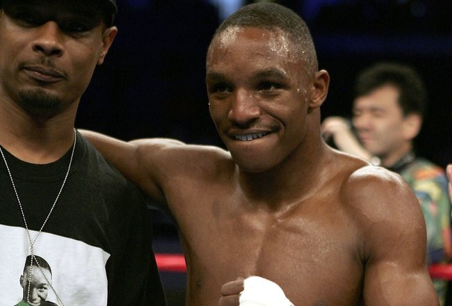 ST. LOUIS - JULY 8:  Trainer Kevin Cunningham (L) celebrates with Devon Alexander after Alexander defeated Tyler Ziolkowski by TKO in the first round on July 8, 2006 at the Savvis Center in St. Louis, Missouri.  (Photo by Elsa/Getty Images)