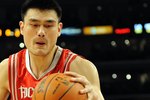 LOS ANGELES, CA - MAY 06:  Yao Ming #11 of the Houston Rockets moves the ball against Andrew Bynum #17 of the Los Angeles Lakers in Game Two of the Western Conference Semifinals during the 2009 NBA Playoffs at Staples Center on May 6, 2009 in Los Angeles, California. NOTE TO USER: User expressly acknowledges and agrees that, by downloading and or using this photograph, User is consenting to the terms and conditions of the Getty Images License Agreement.  (Photo by Harry How/Getty Images)
