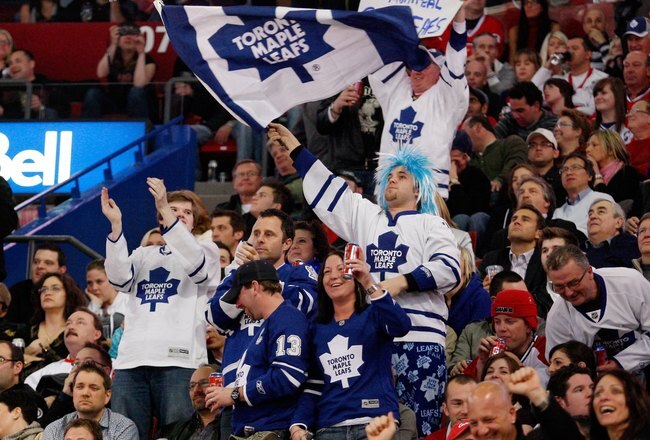 MONTREAL- APRIL 10:  Toronto Maple Leafs fans support tehir team during the NHL game against the Montreal Canadiens on April 10, 2010 at the Bell Centre in Montreal, Quebec, Canada.  The Maple Leafs defeated the Canadiens 4-3 in overtime.  (Photo by Richard Wolowicz/Getty Images) *** Local Caption ***