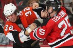 NEWARK, NJ - OCTOBER 24: Riley Cote #32 of the Philadelphia Flyers and Pierre-Luc Leblond #25 of the New Jersey Devils fight on October 24, 2008 at the Prudential Center in Newark, New Jersey. (Photo by Bruce Bennett/Getty Images)