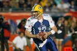 MIAMI GARDENS, FL - JANUARY 31:  Aaron Rodgers #12 of the NFC's Green Bay Packers scrambles out of the pocket during the 2010 AFC-NFC Pro Bowl game at Sun Life Stadium on January 31, 2010 in Miami Gardens, Florida. The AFC defeated the NFC 41-34. (Photo by Scott Halleran/Getty Images)