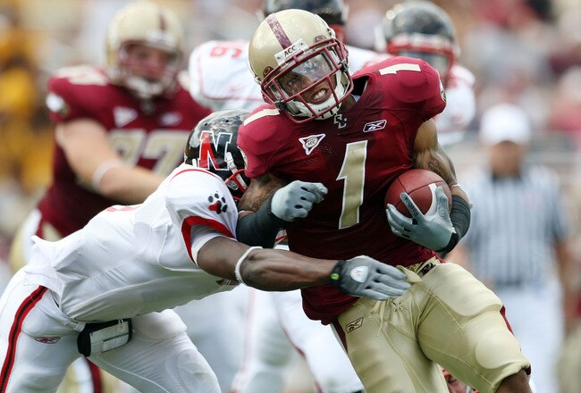CHESTNUT HILL, MA - SEPTEMBER 05:  Josh Haden #1  of the Boston College Eagles carries the ball as Craig Kenney #34 of the Northeastern Huskies makes the tackle on September 5, 2009 at Alumni Stadium in Chestnut Hill, Massachusetts.  (Photo by Elsa/Getty Images)