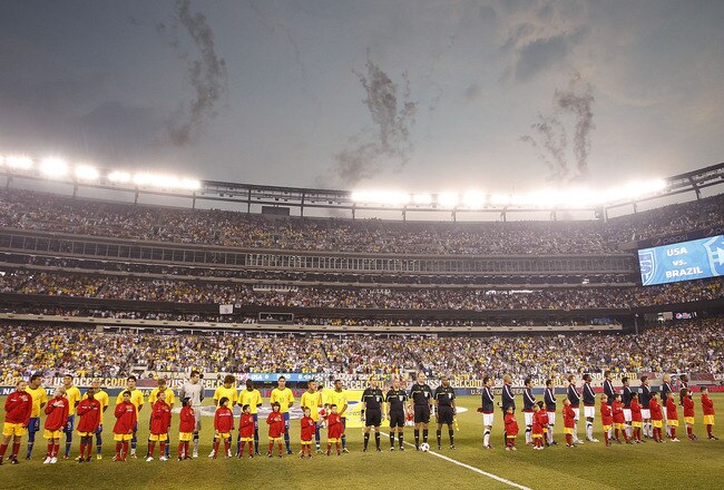 EAST RUTHERFORD, NJ - AUGUST 10:  The U.S. and Brazil stand on the field before a friendly match at the New Meadowlands on August 10, 2010 in East Rutherford, New Jersey.  (Photo by Jeff Zelevansky/Getty Images)