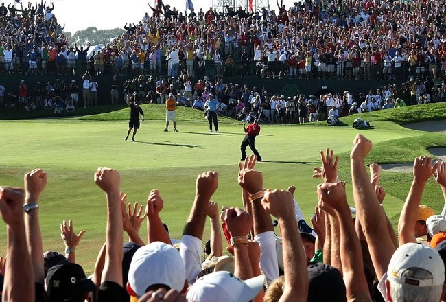 SAN DIEGO - JUNE 15:  Tiger Woods reacts to his birdie putt on the 18th green to force a playoff with Rocco Mediate during the final round of the 108th U.S. Open at the Torrey Pines Golf Course (South Course) on June 15, 2008 in San Diego, California.  (Photo by Harry How/Getty Images)