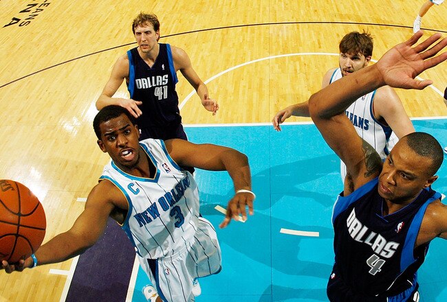 NEW ORLEANS - MARCH 22:  Chris Paul #3 of the New Orleans Hornets shoots the ball over Caron Butler #4 of the Dallas Mavericks at the New Orleans Arena on March 22, 2010 in New Orleans, Louisiana.  The Hornets defeated the Mavericks 115-99.  NOTE TO USER: User expressly acknowledges and agrees that, by downloading and/or using this Photograph, User is consenting to the terms and conditions of the Getty Images License Agreement.  (Photo by Chris Graythen/Getty Images)