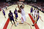 HOUSTON - MAY 08:  Center Luis Scola #4 of the Houston Rockets makes a slam dunk against the Los Angeles Lakers in Game Three of the Western Conference Semifinals during the 2009 NBA Playoffs at Toyota Center on May 8, 2009 in Houston, Texas. NOTE TO USER: User expressly acknowledges and agrees that, by downloading and or using this photograph, User is consenting to the terms and conditions of the Getty Images License Agreement.  (Photo by Ronald Martinez/Getty Images)