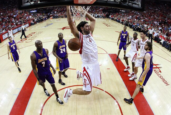HOUSTON - MAY 08:  Center Luis Scola #4 of the Houston Rockets makes a slam dunk against the Los Angeles Lakers in Game Three of the Western Conference Semifinals during the 2009 NBA Playoffs at Toyota Center on May 8, 2009 in Houston, Texas. NOTE TO USER: User expressly acknowledges and agrees that, by downloading and or using this photograph, User is consenting to the terms and conditions of the Getty Images License Agreement.  (Photo by Ronald Martinez/Getty Images)