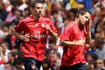 LONDON, ENGLAND - AUGUST 05:  Cesc Fabregas (r) and Robin van Persie attend an Arsenal open training session at Emirates Stadium on August 5, 2010 in London, England.  (Photo by Bryn Lennon/Getty Images)