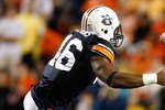 AUBURN, AL - SEPTEMBER 19:  Craig Stevens #46 of the Auburn Tigers tackles quarterback Jarrett Brown #16 of the West Virginia Mountaineers at Jordan-Hare Stadium on September 19, 2009 in Auburn, Alabama.  (Photo by Kevin C. Cox/Getty Images)