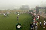 KOHLER, WI - AUGUST 12:  Players putt on the practice green while fans look on during a weather delay before the first round of the 92nd PGA Championship on the Straits Course at Whistling Straits on August 12, 2010 in Kohler, Wisconsin.  (Photo by Andrew Redington/Getty Images)