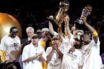 LOS ANGELES, CA - JUNE 17:  Derek Fisher #2 and Kobe Bryant #24 of the Los Angeles Lakers hold up the Larry O'Brien trophy and the MVP trophy after the Lakers defeated the Boston Celtics in Game Seven of the 2010 NBA Finals at Staples Center on June 17, 2010 in Los Angeles, California.  NOTE TO USER: User expressly acknowledges and agrees that, by downloading and/or using this Photograph, user is consenting to the terms and conditions of the Getty Images License Agreement.  (Photo by Christian Petersen/Getty Images)