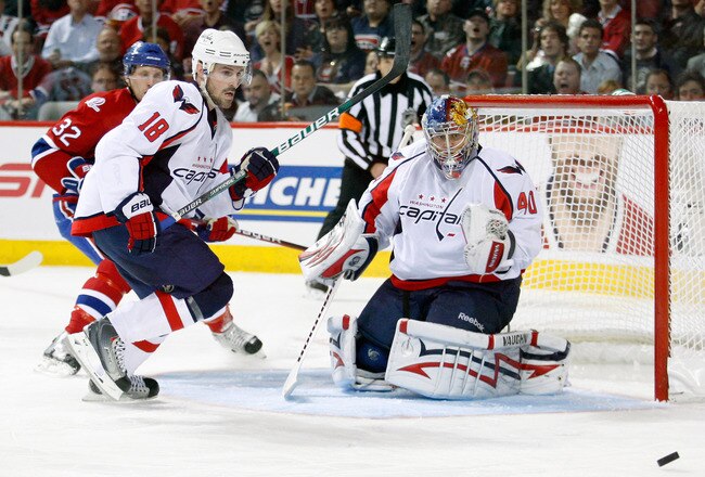 MONTREAL- APRIL 26:  Eric Belanger #18 and Semyon Varlamov #40 of the Washington Capitals watch the rebounding puck in Game Six of the Eastern Conference Quarterfinals against the Montreal Canadiens during the 2010 NHL Stanley Cup Playoffs at the Bell Centre on April 26, 2010 in Montreal, Quebec, Canada.  (Photo by Richard Wolowicz/Getty Images)