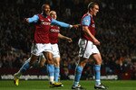 BIRMINGHAM, ENGLAND - OCTOBER 05:  Richard Dunne (R) of Aston Villa walks away after scoring the opening goal during the Barclays Premier League match between Aston Villa and Manchester City at Villa Park on October 5, 2009 in Birmingham, England.  (Photo by Clive Rose/Getty Images)
