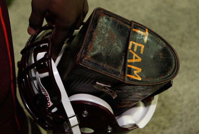 ATLANTA - DECEMBER 31:  Safety Kam Chancellor #17 of the Virginia Tech Hokies carries his helmet and lunch pail inscribed with the word 'Team' on it after the Chick-Fil-A Bowl against the Tennessee Volunteers at the Georgia Dome on December 31, 2009 in Atlanta, Georgia.  The Hokies beat the Volunteers 37-14.  (Photo by Mike Zarrilli/Getty Images)