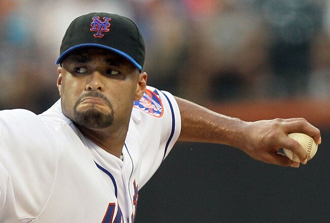 NEW YORK - JULY 06:  Johan Santana #57 of the New York Mets delivers a pitch against the Cincinnati Reds on July 6, 2010 at Citi Field in the Flushing neighborhood of the Queens borough of New York City.  (Photo by Jim McIsaac/Getty Images)