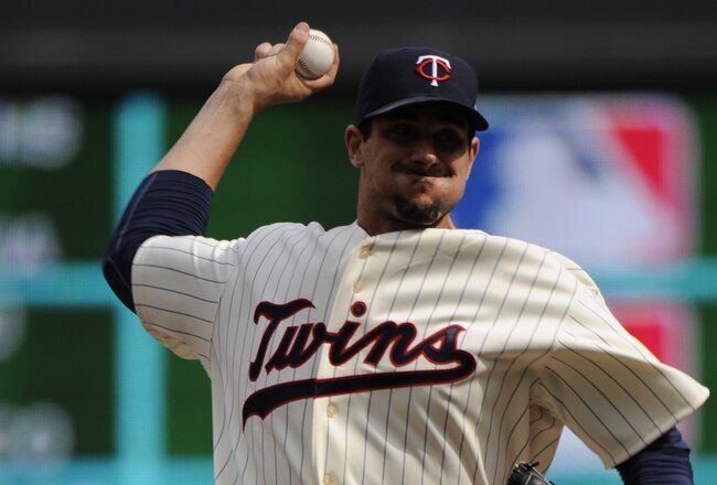 MINNESOTA, MN - APRIL 12: Carl Pavano #48 of the Minnesota Twins pitches in the first inning against the Boston Red Sox during the Twins home opener at Target Field on April 12, 2010 in Minneapolis, Minnesota. (Photo by Hannah Foslien /Getty Images)