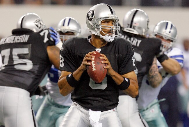 ARLINGTON, TX - AUGUST 12:  Jason Campbell #18 looks to pass in the preseason game againsts the Dallas Cowboys at Dallas Cowboys Stadium on August 12, 2010 in Arlington, Texas.  (Photo by Tom Pennington/Getty Images)