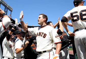 SAN FRANCISCO - AUGUST 12: Pat Burrell #9 of the San Francisco Giants celebrates after hitting a grand slam against the Chicago Cubs in the fifth inning during an MLB game at AT&T Park on August 12, 2010 in San Francisco, California. (Photo by Jed Jacobsohn/Getty Images)