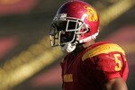 LOS ANGELES, CA - DECEMBER 03:  Reggie Bush #5 of the USC Trojans looks on against the UCLA Bruins December 3, 2005 at the Los Angeles Memorial Coliseum in Los Angeles, California. USC won 66-19. (Photo by Stephen Dunn/Getty Images)