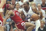 8 Jun 1997: Dennis Rodman (left) of the Chicago Bulls is hit hard by Karl Malone of the Jazz during the Bulls 73-78 loss to the Utah Jazz in Game 4 of the NBA Finals at the Delta Center in Salt Lake City, Utah.