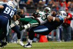 NASHVILLE, TN - NOVEMBER 23:  Kevin Vickerson #96 of the Tennessee Titans lifts and tackles running back Thomas Jones #20 of the New York Jets during the game at LP Field on November 23, 2008 in Nashville, Tennessee.  (Photo by Kevin C. Cox/Getty Images)