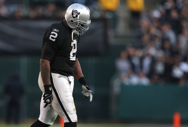 OAKLAND, CA - JANUARY 03:  JaMarcus Russell #2 of the Oakland Raiders walks off the field against the Baltimore Ravens during an NFL game at Oakland-Alameda County Coliseum on January 3, 2010 in Oakland, California.  (Photo by Jed Jacobsohn/Getty Images)