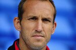 BOLTON, ENGLAND - AUGUST 14:  Mark Schwarzer of Fulham looks on from the stands during the Barclays Premier League match between Bolton Wanderers and Fulham at Reebok Stadium on August 14, 2010 in Bolton, England.  (Photo by Laurence Griffiths/Getty Images)