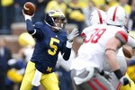 ANN ARBOR, MI - NOVEMBER 21: Tate Forcier #5 of the Michigan Wolverines throws a first quarter pass while playing the Ohio State Buckeyes on November 21, 2009 at Michigan Stadium in Ann Arbor, Michigan.  (Photo by Gregory Shamus/Getty Images)