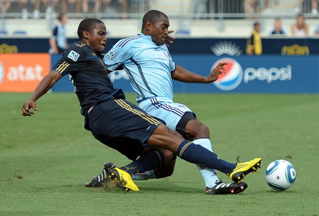 CHESTER, PA - AUGUST 14:  Danny Mwanga #10 of the Philadelphia Union takes a shot on goal around Marvell Wynne #22 of the Colorado Rapids at PPL Park on August 14, 2010 in Chester, Pennsylvania.  (Photo by Drew Hallowell/Getty Images)