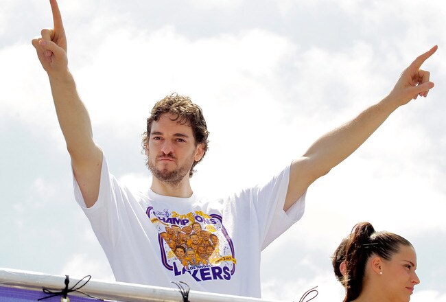 LOS ANGELES, CA - JUNE 21:  Los Angeles Lakers forward Pau Gasol salutes the crowd while riding in the victory parade for the the NBA basketball champion team on June 21, 2010 in Los Angeles, California. The Lakers beat the Boston Celtics 87-79 in 7 games for the franchise's 16 NBA title.  (Photo by Noel Vasquez/Getty Images)
