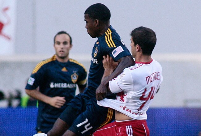 HARRISON, NJ - AUGUST 14: Carlos Mendes #44 of the New York Red Bulls gets tangled up with Edson Buddle #14 of the Los Angeles Galaxy during the game at Red Bull Arena on August 14, 2010 in Harrison, New Jersey. The Galaxy defeated the Red Bulls 1-0.  (Photo by Andy Marlin/Getty Images )