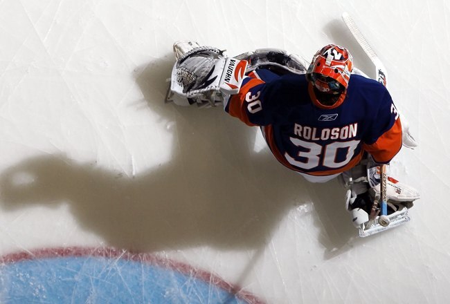 UNIONDALE, NY - APRIL 03:  Dwayne Roloson #30 of the New York Islanders warms up before playing against the Ottawa Senators on April 3, 2010 at Nassau Coliseum in Uniondale, New York.  (Photo by Jim McIsaac/Getty Images)