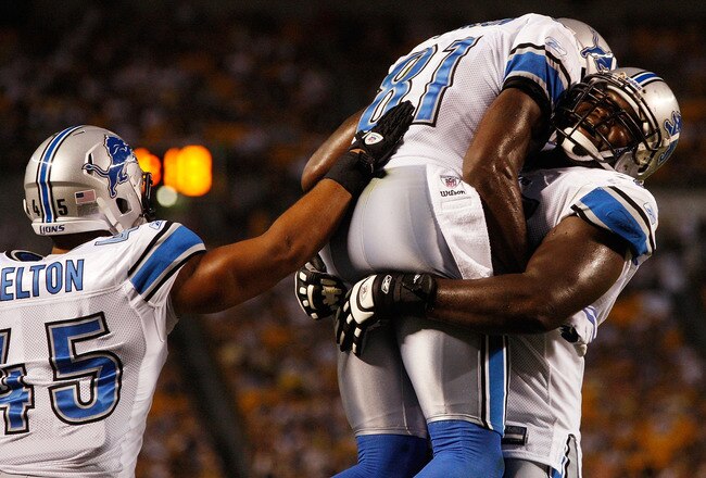 PITTSBURGH - AUGUST 14:  Calvin Johnson #81 of the Detroit Lions celebrates with teammates Jerome Felton #45 and Gosder Cherilus #77 during the preseason game against the Pittsburgh Steelers on August 14, 2010 at Heinz Field in Pittsburgh, Pennsylvania.  (Photo by Jared Wickerham/Getty Images)