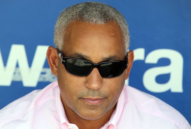 PHILADELPHIA - MAY 01:  General manager Omar Minaya of the New York Mets looks on as his team takes batting practice before playing the Philadelphia Phillies at Citizens Bank Park on May 1, 2010 in Philadelphia, Pennsylvania.  (Photo by Jim McIsaac/Getty Images)