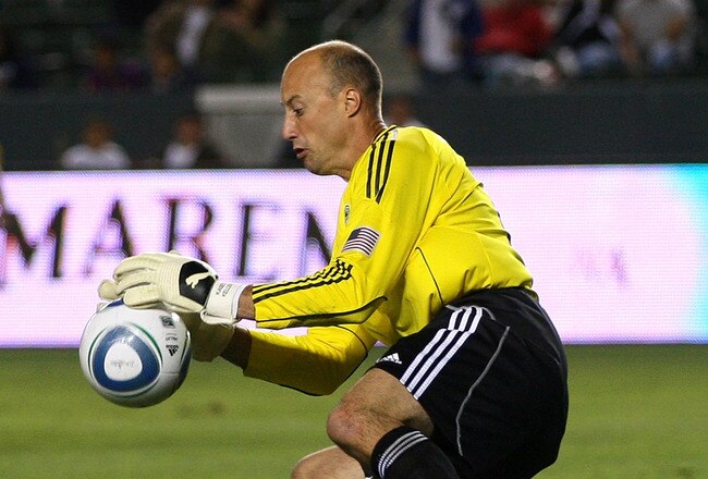 CARSON, CA - AUGUST 14:  Goalkeeper Kasey Keller #18 of Seattle Sounders makes a save as teammate James Riley #7 looks on in the second half during their MLS match against Chivas USA at The Home Depot Center on August 14, 2010 in Carson, California. Sounders FC and Chivas USA played to a 0-0 draw. (Photo by Victor Decolongon/Getty Images)