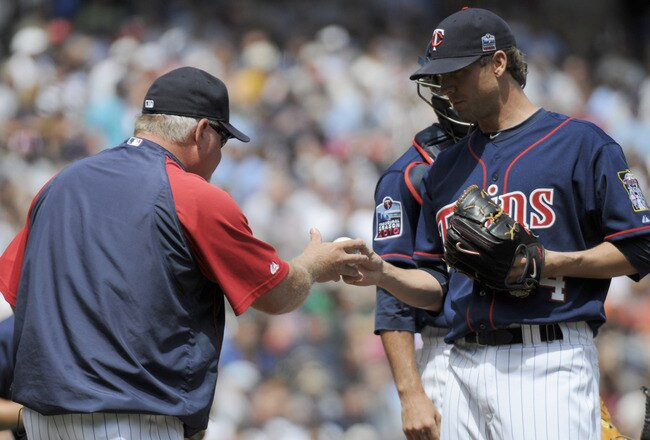 MINNEAPOLIS, MN - JUNE 30: Manager Ron Gardenhire #35 of the Minnesota Twins takes the ball from Matt Guerrier #54 as he puller Guerrier from the game in the eighth inning against the Detroit Tigers during their game on June 30, 2010 at Target Field in Minneapolis, Minnesota. Twins won 5-1. (Photo by Hannah Foslien /Getty Images)