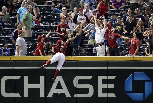 PHOENIX - AUGUST 08:  Outfielder Gerardo Parra #18 of the Arizona Diamondbacks attempts to catch a 2 run home run hit by Chris Denorfia (not pictured) of the San Diego Padres during the Major League Baseball game at Chase Field on August 8, 2010 in Phoenix, Arizona. The Padres defeated the Diamondbacks 10-1.  (Photo by Christian Petersen/Getty Images)
