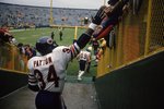 21 May 1999: Walter Payton #34 of the Chicago Bears shakes hands with fans before a game against the Green Bay Packers in Green Bay, Wisconsin.