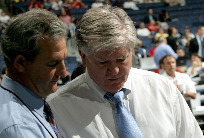 COLUMBUS, OH - JUNE 22:  General Manager Brian Burke (R) of the Anaheim Ducks speaks to General Manager Darryl Sutter of the Calgary Flames during the first round of the 2007 NHL Entry Draft at Nationwide Arena on June 22, 2007 in Columbus, Ohio.  (Photo by Bruce Bennett/Getty Images)