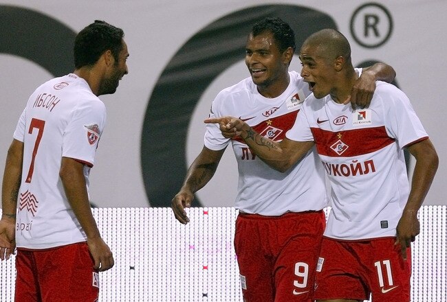 MOSCOW, RUSSIA - AUGUST 15: Welliton (R) of FC Spartak Moscow celebrates with team mates Ibson (L) and  Ari after scoring a goal during the Russian Football League Championship match betweenFC Lokomotiv and FC Spartak at the Lokomotiv Stadium on August 15, 2010 in Moscow, Russia.  (Photo by Vladimir Pesnya/Epsilon/Getty Images)