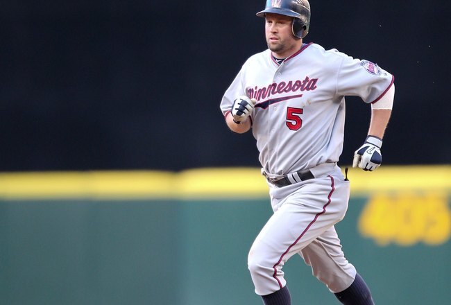 SEATTLE - MAY 31:  Michael Cuddyer #5 of the Minnesota Twins rounds the bases after homering against the Seattle Mariners at Safeco Field on May 31, 2010 in Seattle, Washington. (Photo by Otto Greule Jr/Getty Images)