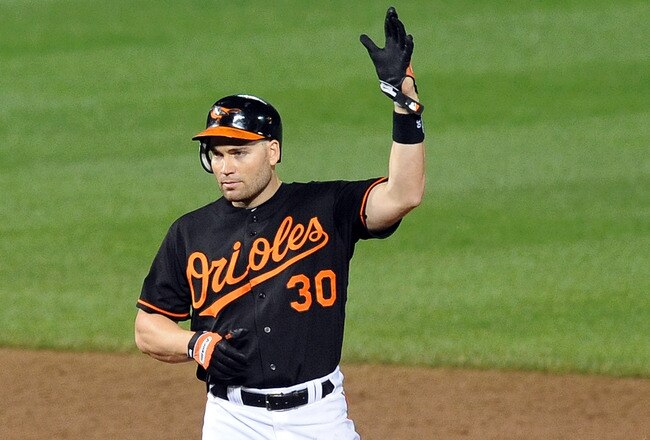 BALTIMORE - MAY 14:  Luke Scott #30 of the Baltimore Orioles celebrates after a hit in the sixth inning against the Cleveland Indians at Camden Yards on May 14, 2010 in Baltimore, Maryland.  (Photo by Greg Fiume/Getty Images)