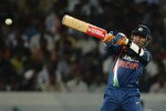 HYDERABAD, INDIA - NOVEMBER 05:  Virender Sehwag of India hits out during the fifth One Day International match between India and Australia at Rajiv Gandhi International Cricket Stadium on November 5, 2009 in Hyderabad, India.  (Photo by Mark Kolbe/Getty Images)