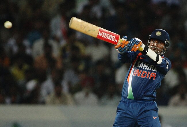 HYDERABAD, INDIA - NOVEMBER 05:  Virender Sehwag of India hits out during the fifth One Day International match between India and Australia at Rajiv Gandhi International Cricket Stadium on November 5, 2009 in Hyderabad, India.  (Photo by Mark Kolbe/Getty Images)