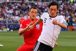 BLOEMFONTEIN, SOUTH AFRICA - JUNE 27:  Mesut Oezil of Germany is closed down by John Terry of England during the 2010 FIFA World Cup South Africa Round of Sixteen match between Germany and England at Free State Stadium on June 27, 2010 in Bloemfontein, South Africa.  (Photo by Clive Rose/Getty Images)