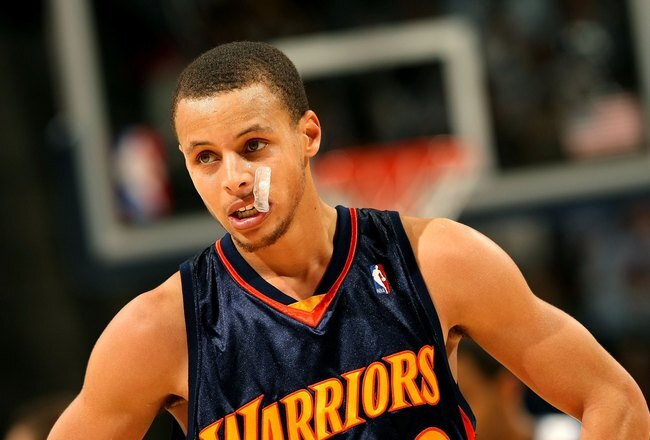 DENVER - JANUARY 05:  Stephen Curry #30 of the Golden State Warriors looks on during a break in the action against the Denver Nuggets at the Pepsi Center on January 5, 2010 in Denver, Colorado. The Nuggets defeated the Warriors 123-122. NOTE TO USER: User expressly acknowledges and agrees that, by downloading and/or using this Photograph, user is consenting to the terms and conditions of the Getty Images License Agreement.  (Photo by Doug Pensinger/Getty Images)