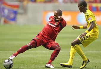 SANDY, UT - AUGUST 14: Andy Williams #77 of Real Salt Lake kicks the ball past Shaun Francis #29 of the Columbus Crew during the second half of an MLS soccer game August 14, 2010 at Rio Tinto Stadium in Sandy, Utah. Real Salt Lake beat the Columbus Crew 2-0. (Photo by George Frey/Getty Images)
