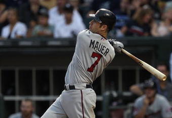CHICAGO - AUGUST 10: Joe Mauer #7 of the Minnesota Twins hits a two-run home run in the 2nd inning against the Chicago White Sox at U.S. Cellular Field on August 10, 2010 in Chicago, Illinois. (Photo by Jonathan Daniel/Getty Images)